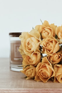An elegant display of various rose candle bouquets.