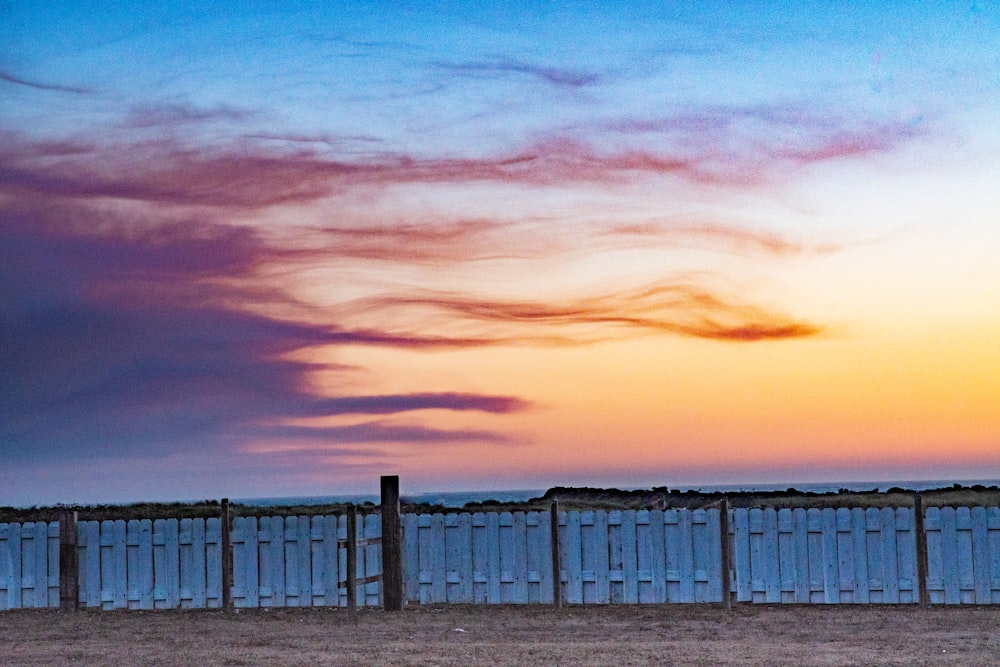 silhouette of fence during sunset