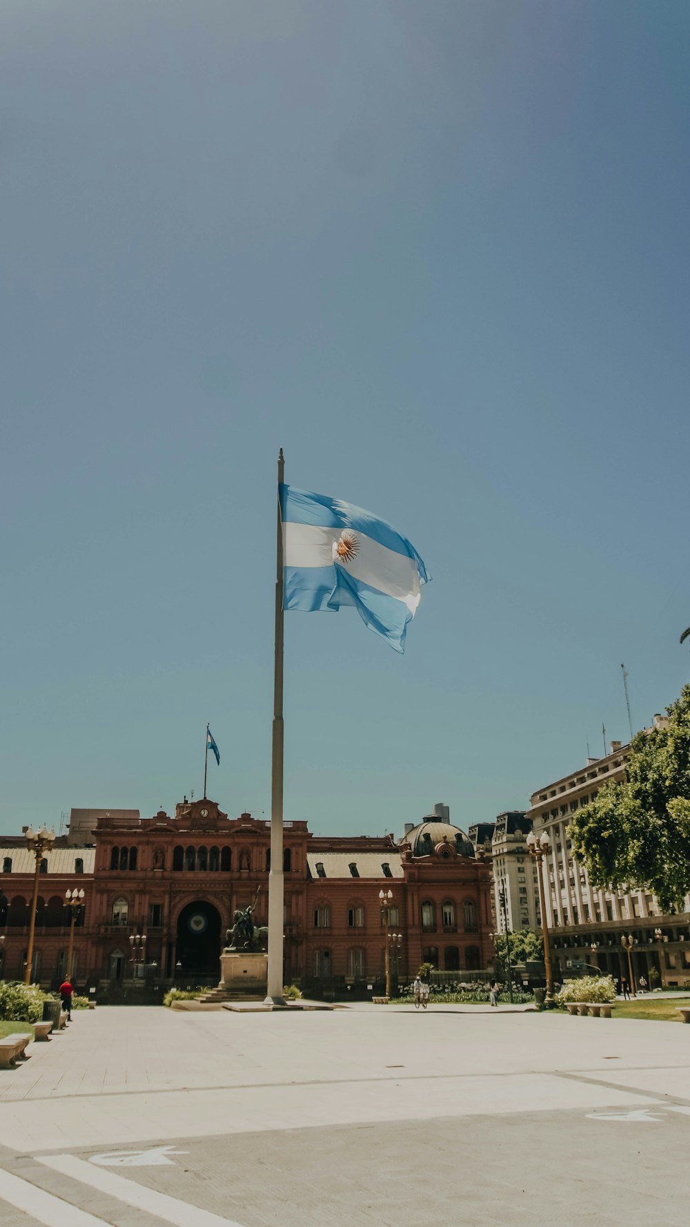 white and blue flag on pole