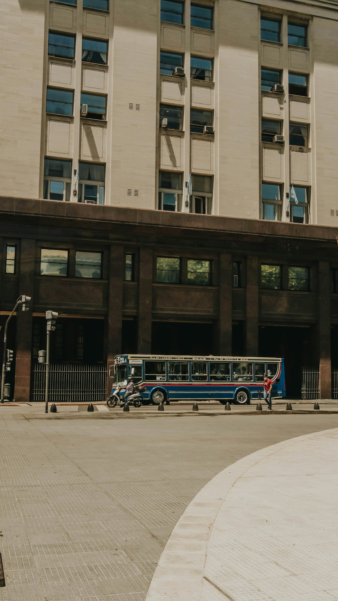 white and blue bus on road near building during daytime