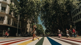 woman in black tank top and white shorts standing on basketball court during daytime
