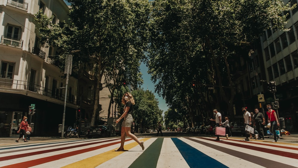 woman in black tank top and white shorts standing on basketball court during daytime