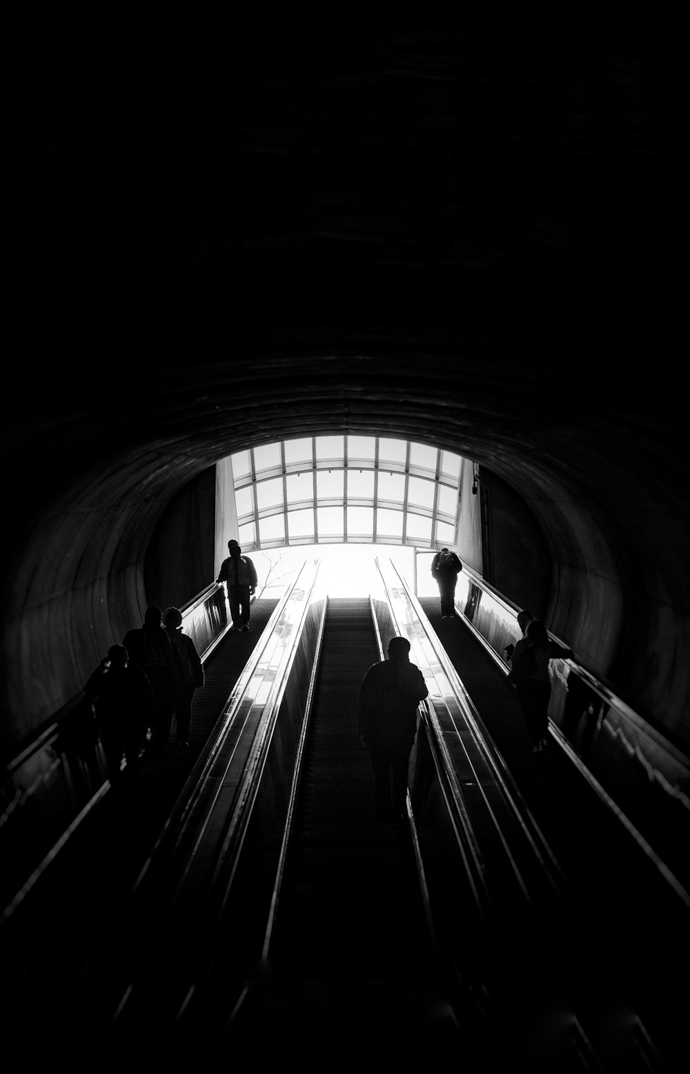 people walking on tunnel during daytime