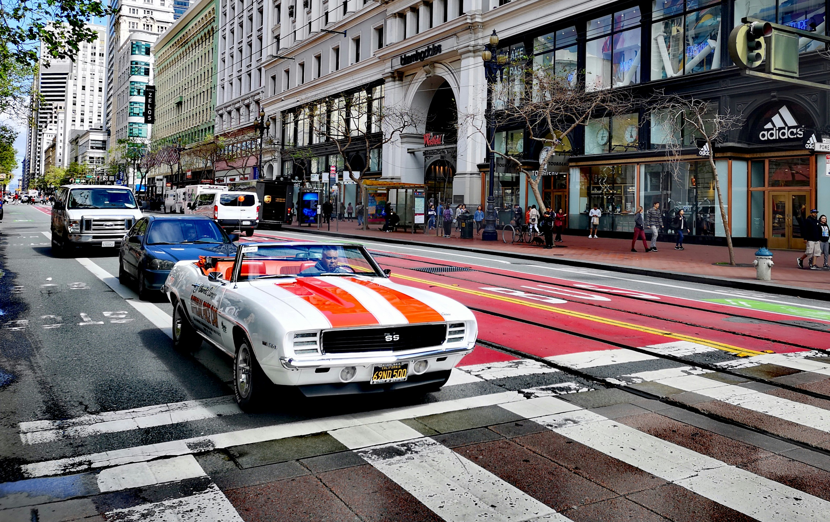 white and red car on road during daytime