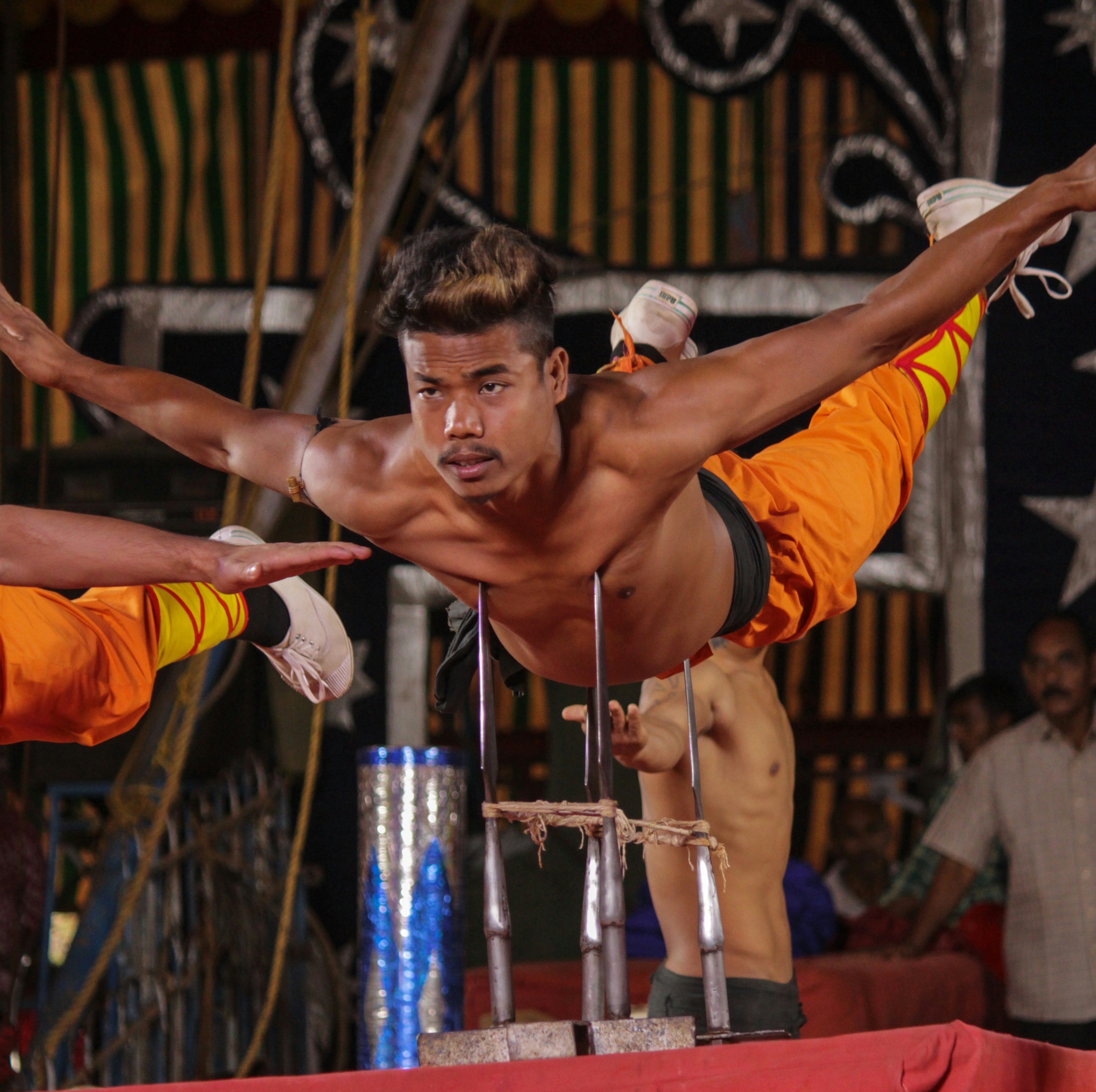 man in orange shorts doing exercise