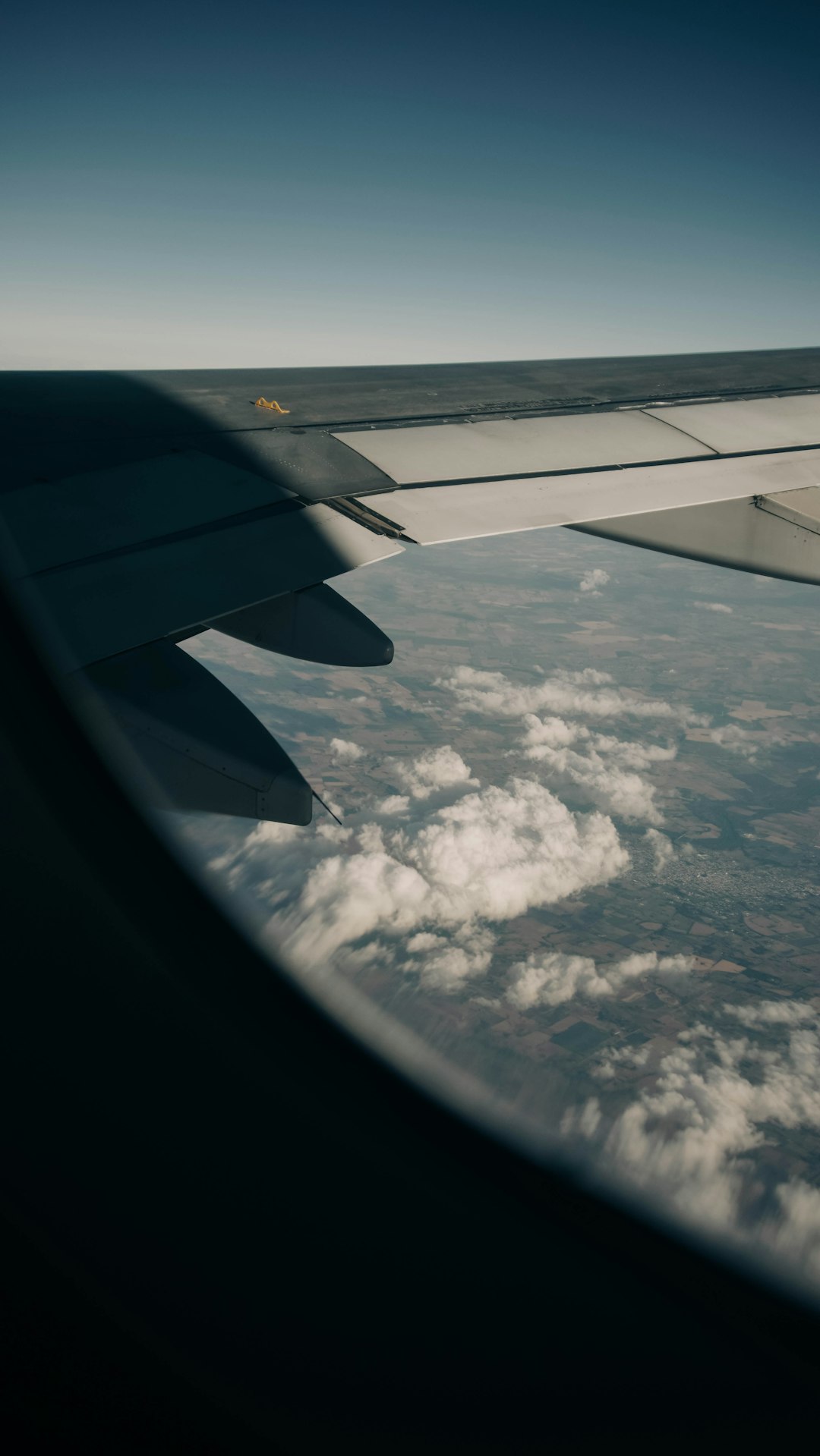 airplane window view of white clouds during daytime