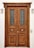 A large wooden double door with intricate carvings and metal grilles in the upper panels. The door features two ornate circular handles and is framed by a plain white wall. Two wall-mounted outdoor lights are placed symmetrically on either side of the door.