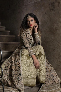 woman in brown and beige floral dress sitting on chair