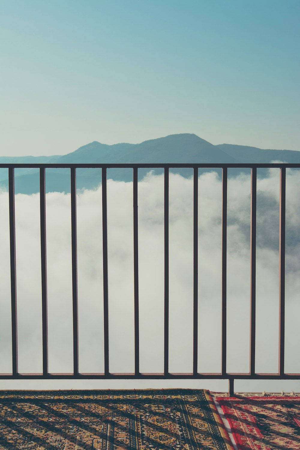 white wooden fence near mountain during daytime