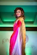 A fashion show featuring South Asian inspired designs on a lively runway.