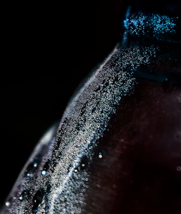 Refreshing bottle of vidama’s premium water with condensation droplets.