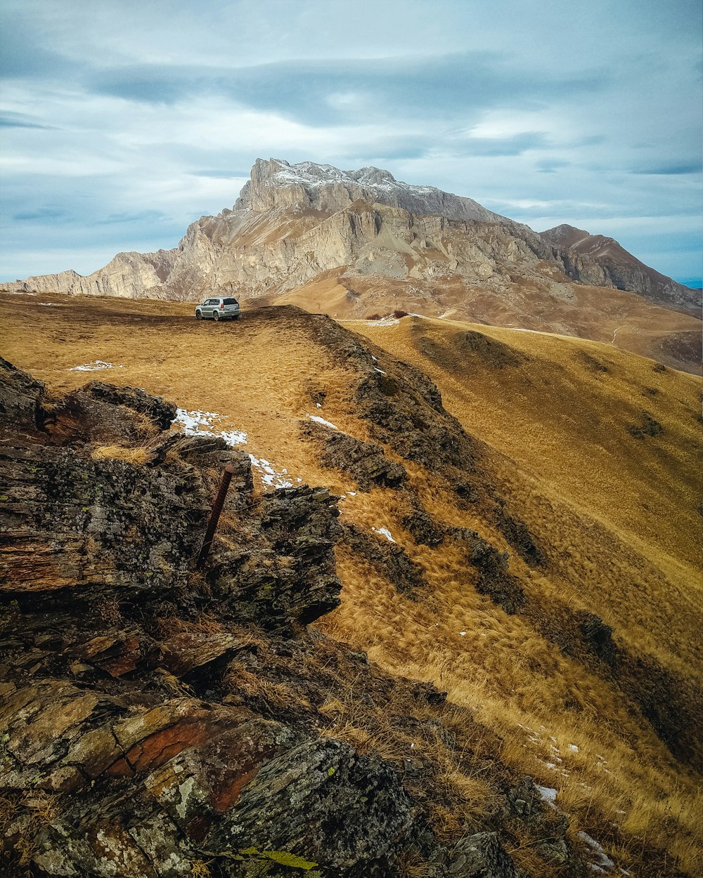 people walking on brown and green mountain during daytime