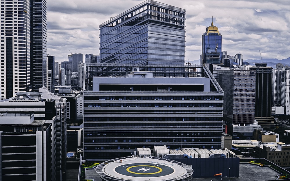 white and black stadium under white clouds during daytime