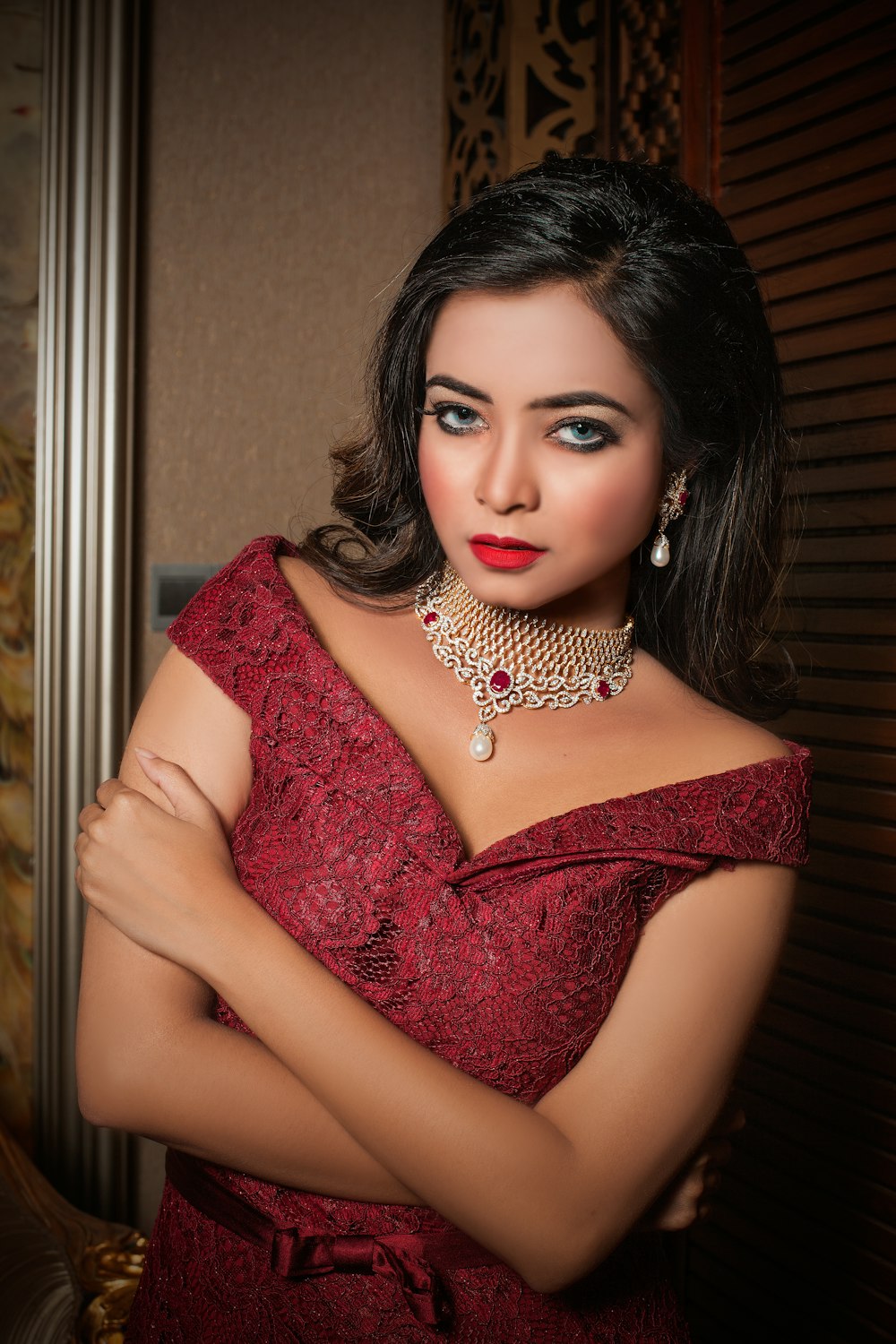 woman in red floral lace dress