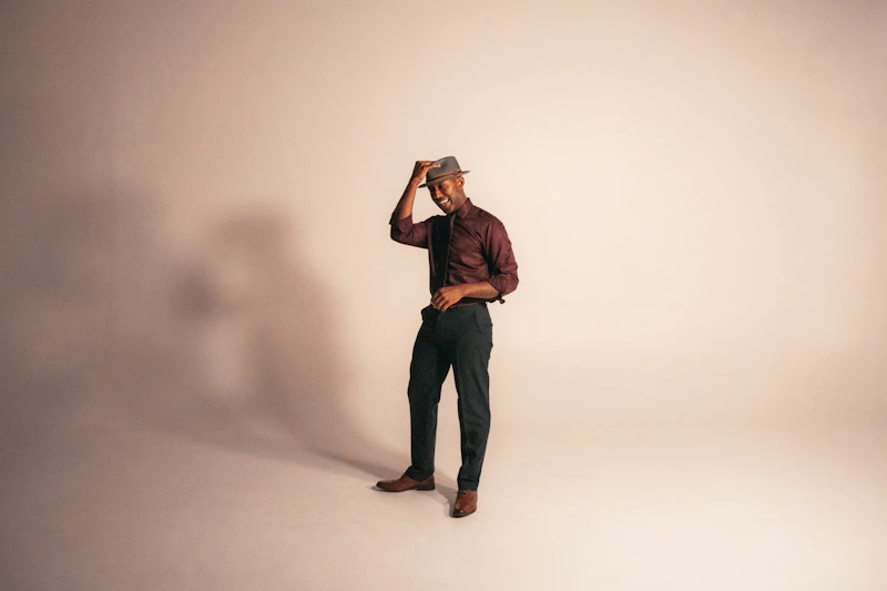 stylish man wearing brown fedora and dress shirt