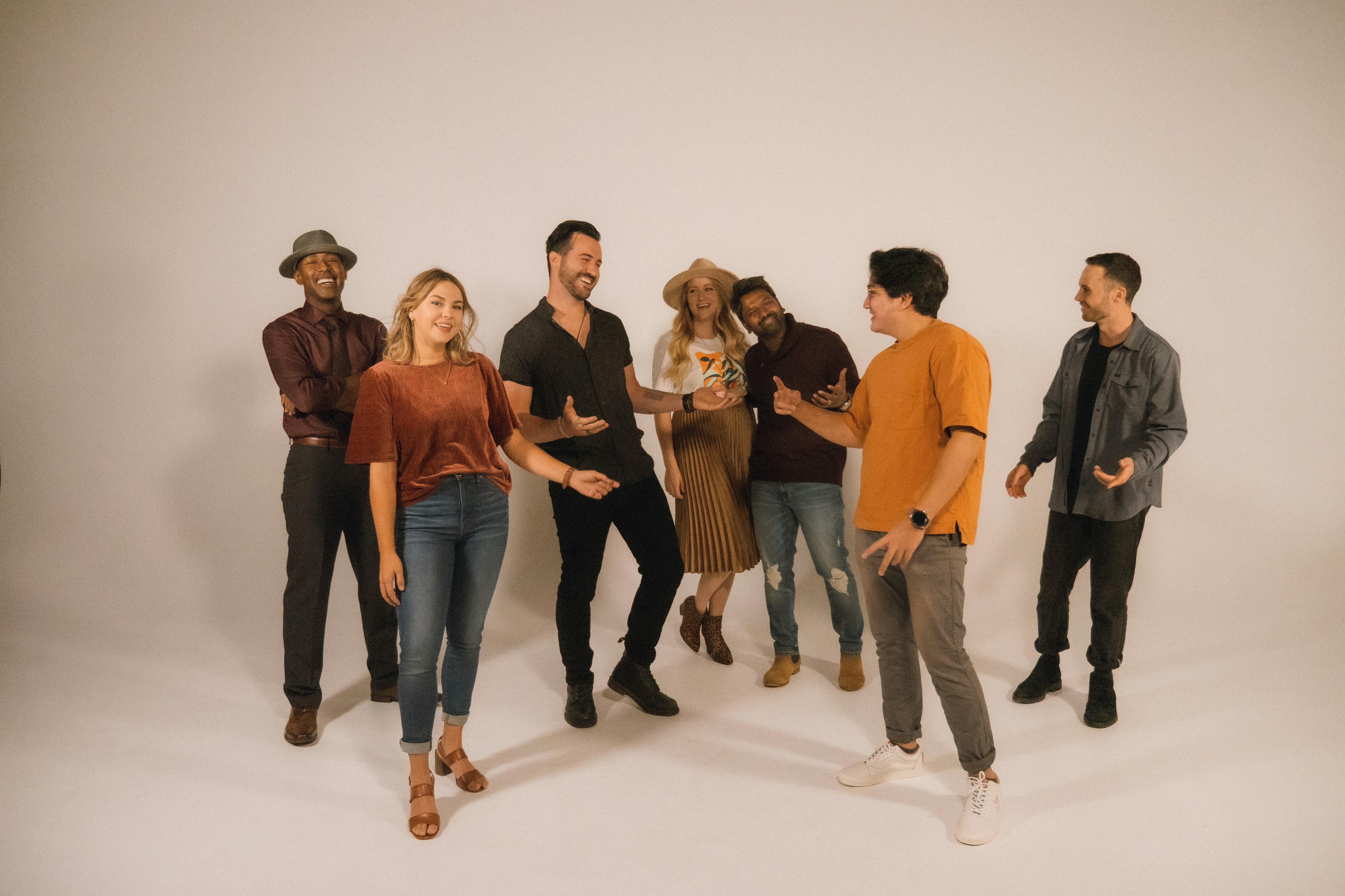 group of people standing on white floor
