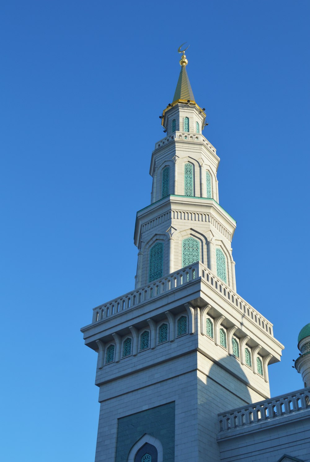 white and brown concrete building under blue sky during daytime