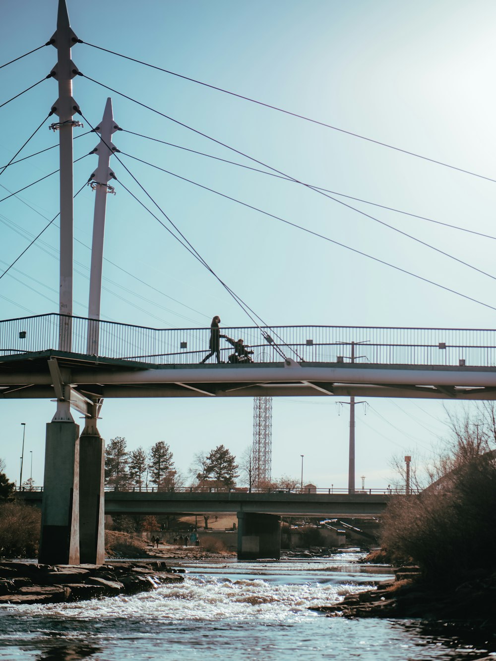 white bridge over body of water during daytime