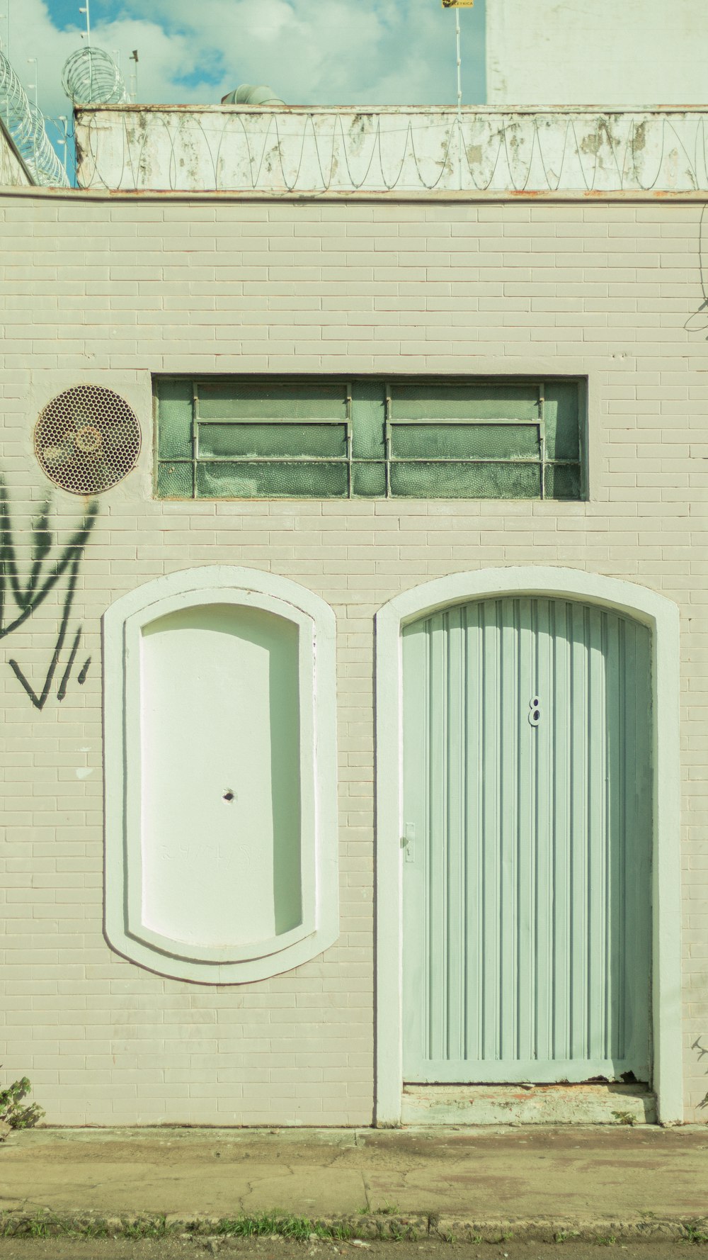 white wooden door with black steel door knob