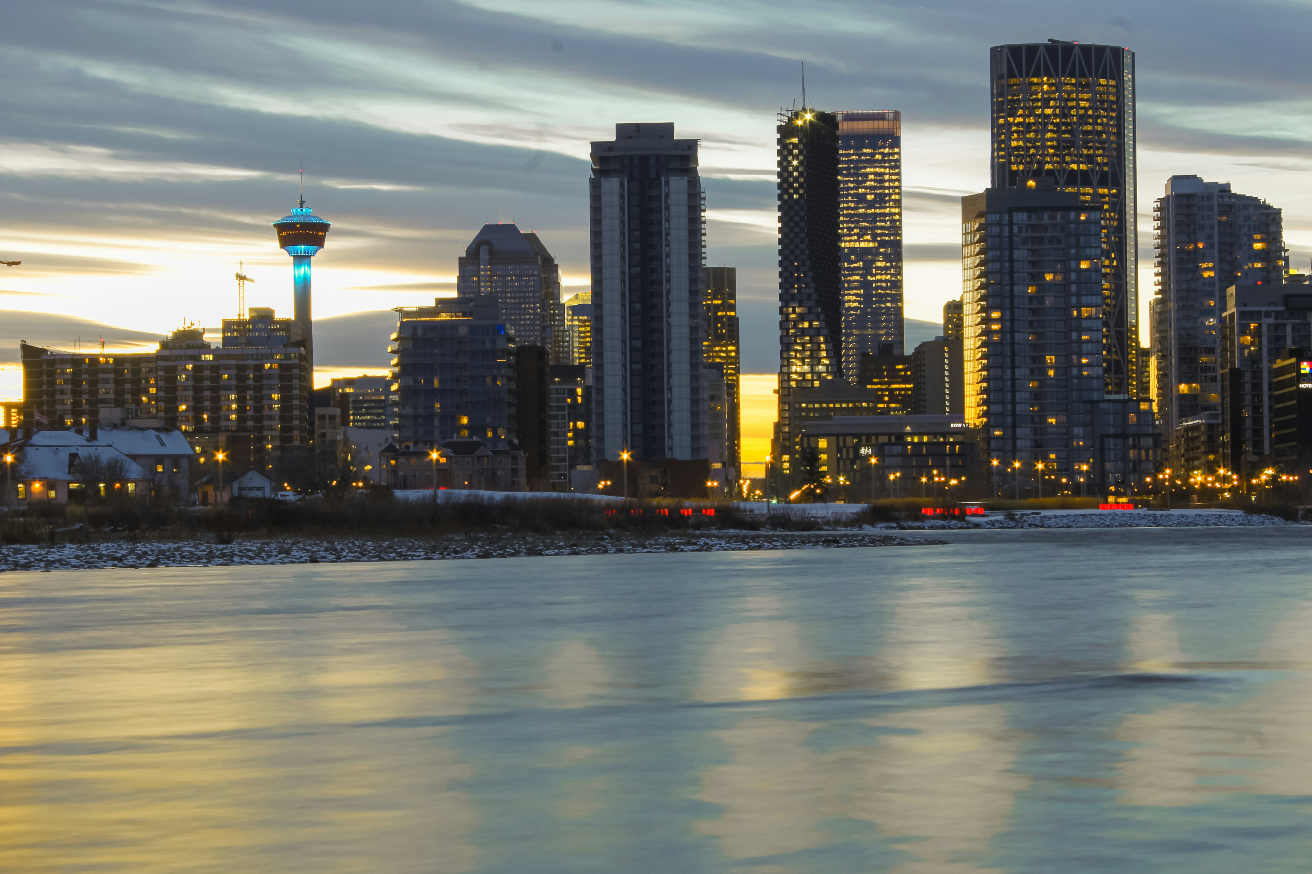 Calgary skyline at night reflecting on the Bow River