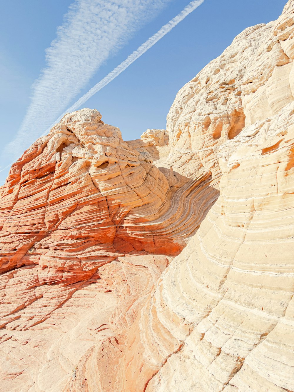 a plane is flying over a rock formation