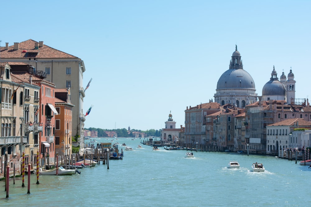 boat on water near buildings during daytime