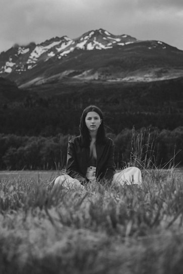 Portrait of Scarlett McCrary sitting peacefully outdoors with soft Appalachian mountains in the background.