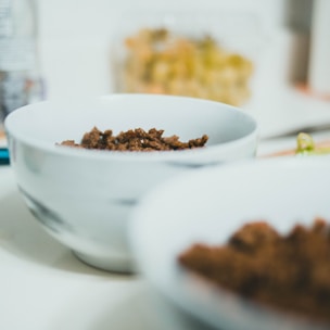 Close-up of seasoned köfte (meatballs) ready for cooking.