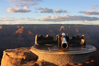 black binoculars on brown rock during daytime