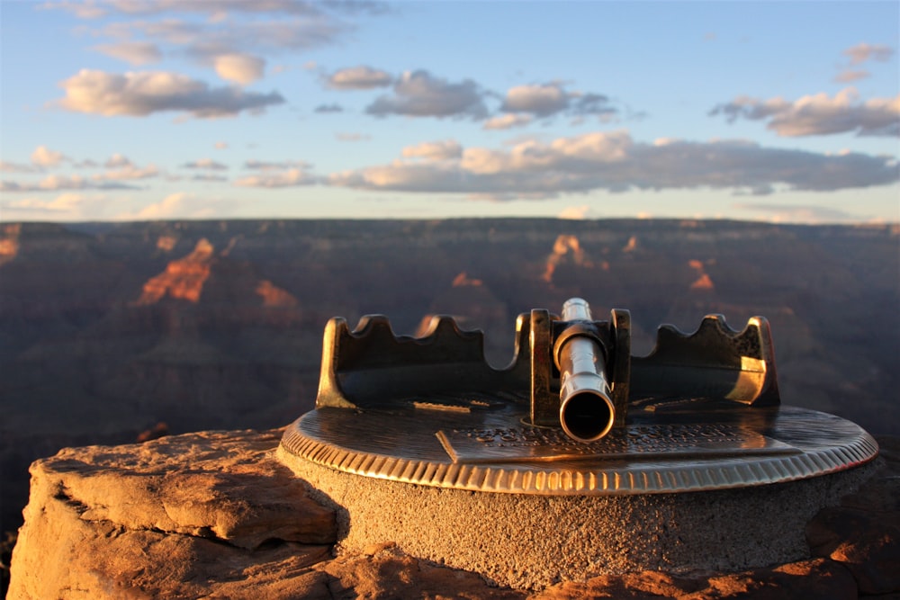 black binoculars on brown rock during daytime