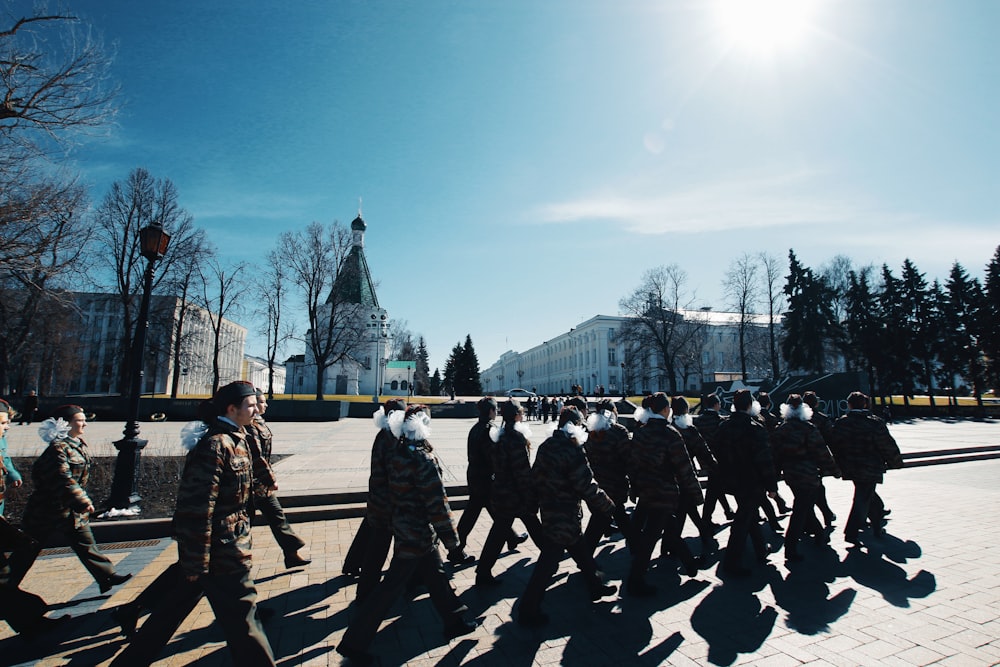 people walking on snow covered ground during daytime