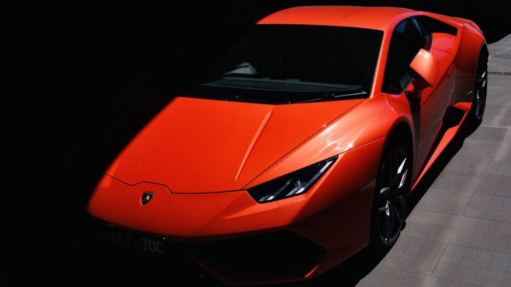 red ferrari 458 italia on black background