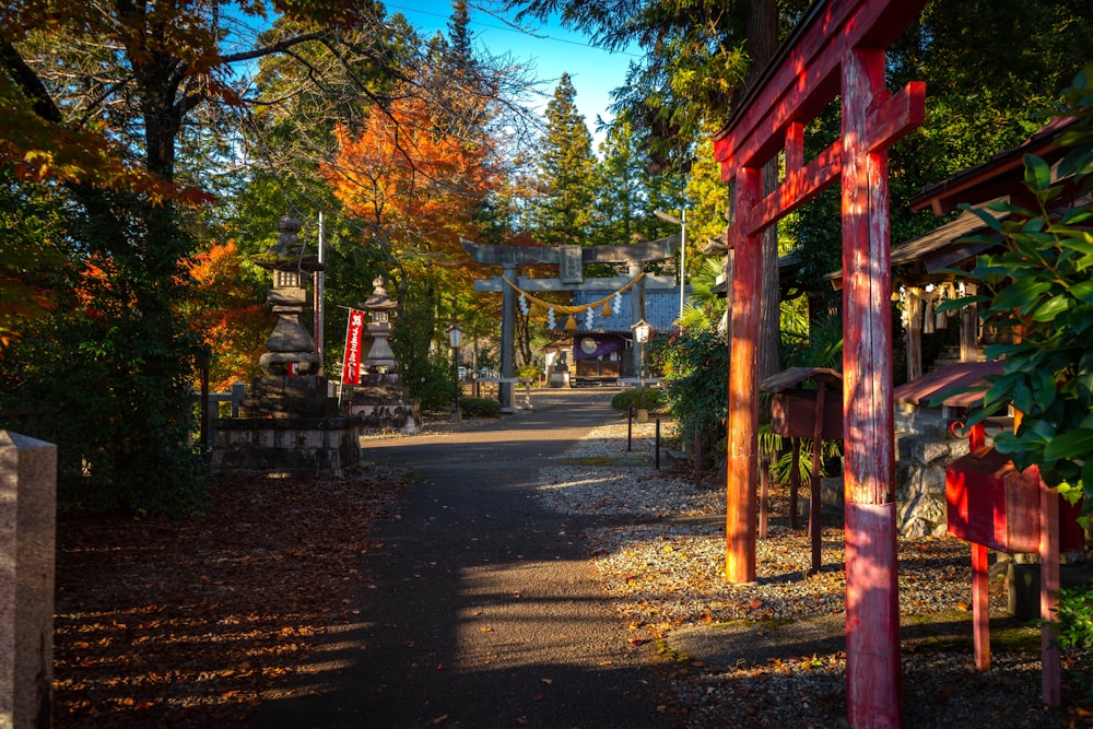 brown wooden post near green trees during daytime