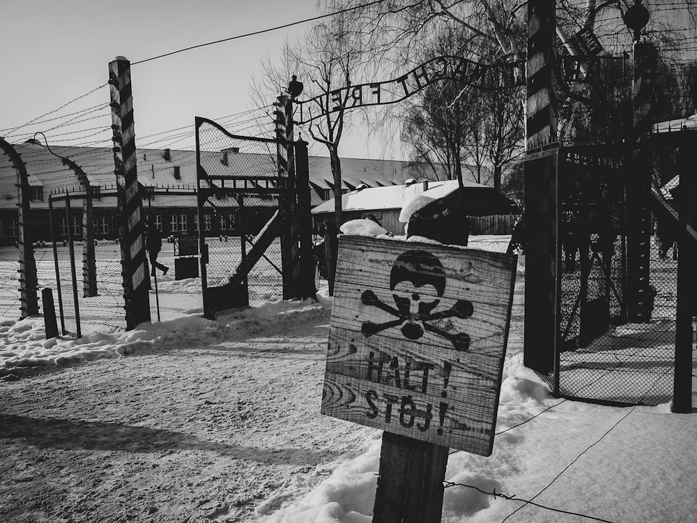 grayscale photo of wooden signage