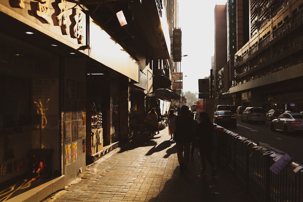 people walking on sidewalk during daytime