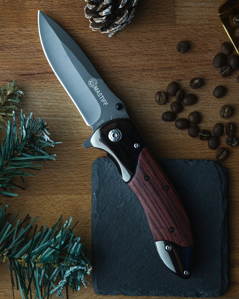 brown handle silver knife on brown wooden table