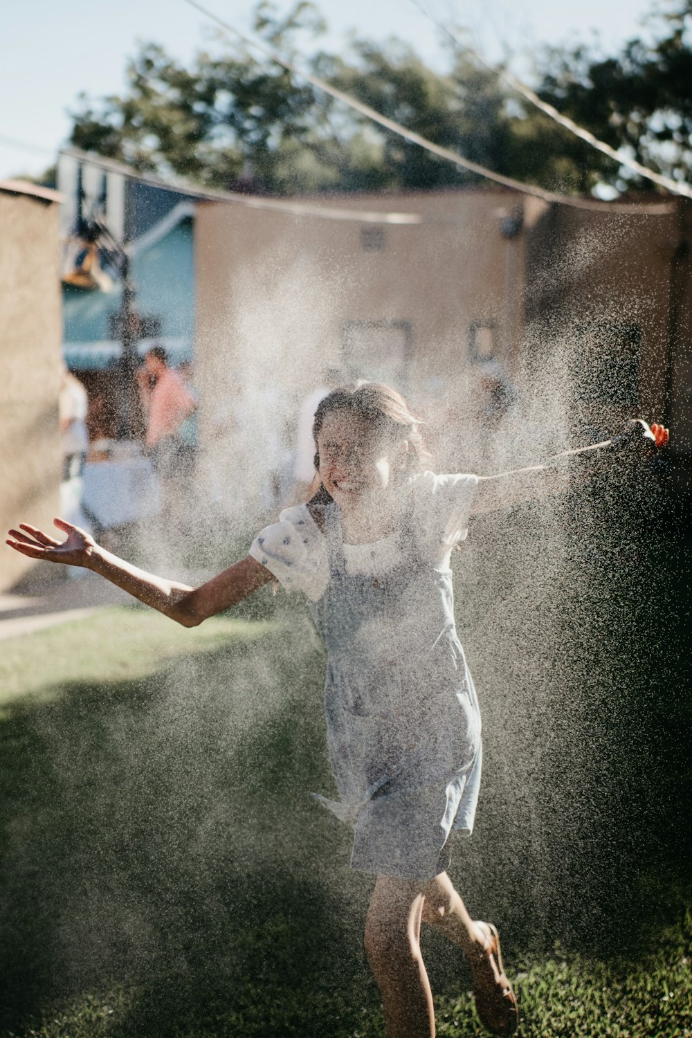 girl in white t-shirt playing with bubbles