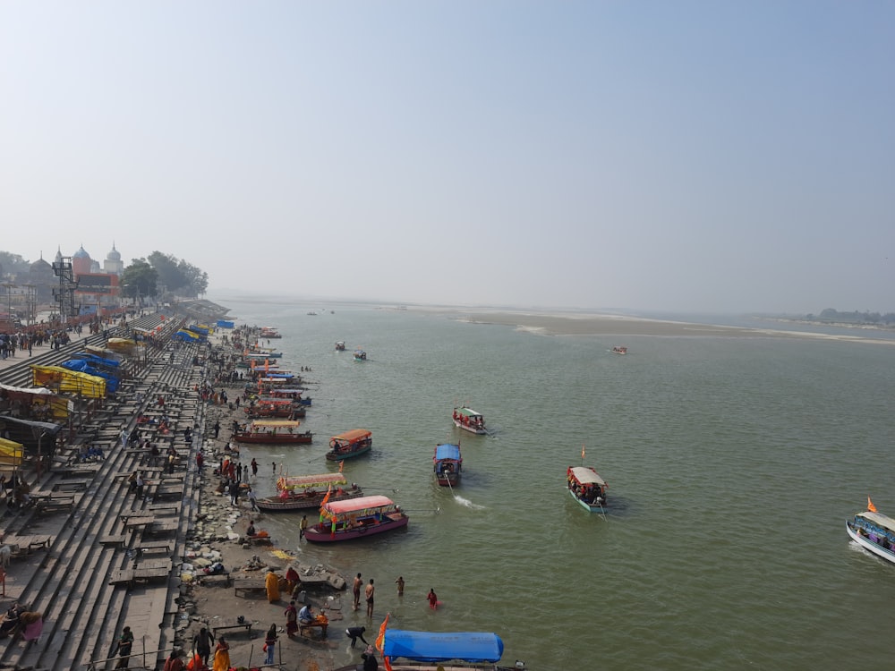 boats on sea near city during daytime