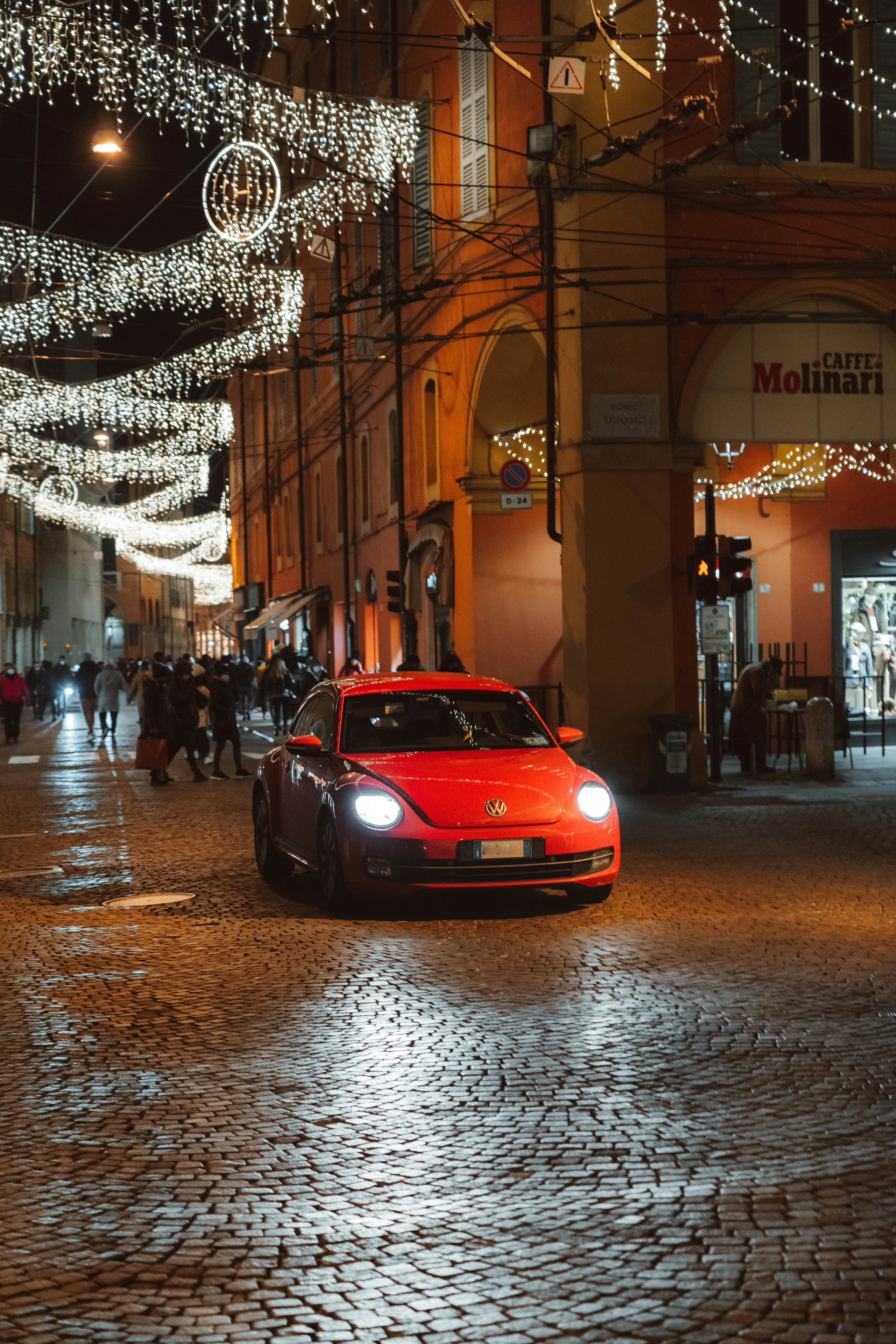 red car on road during night time