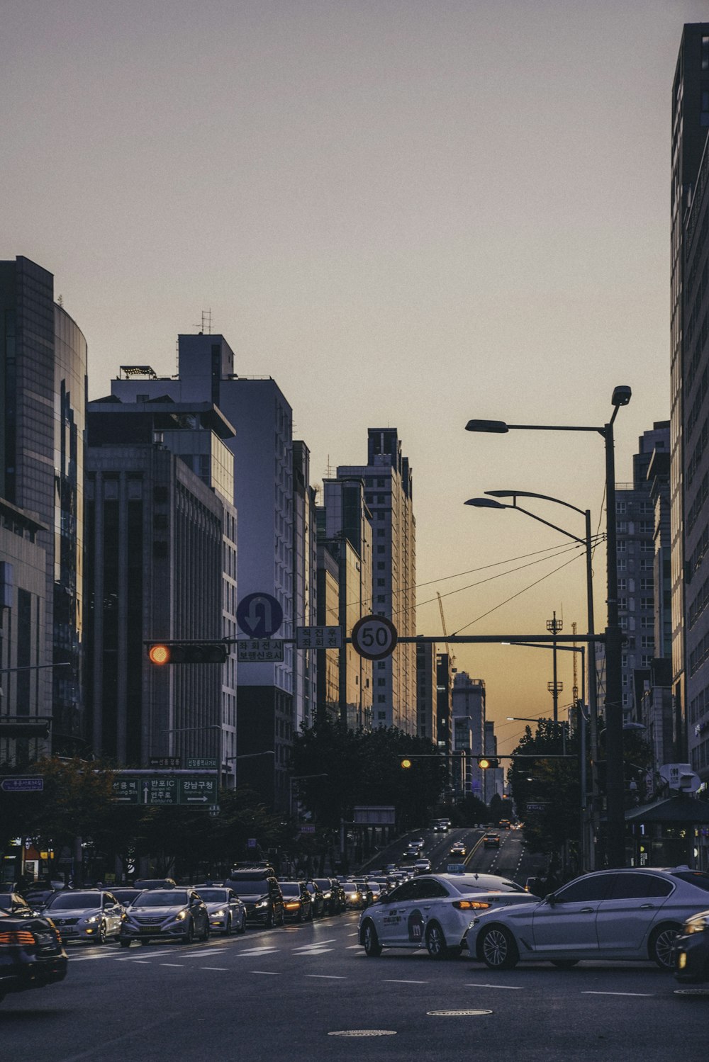 cars on road near buildings during daytime