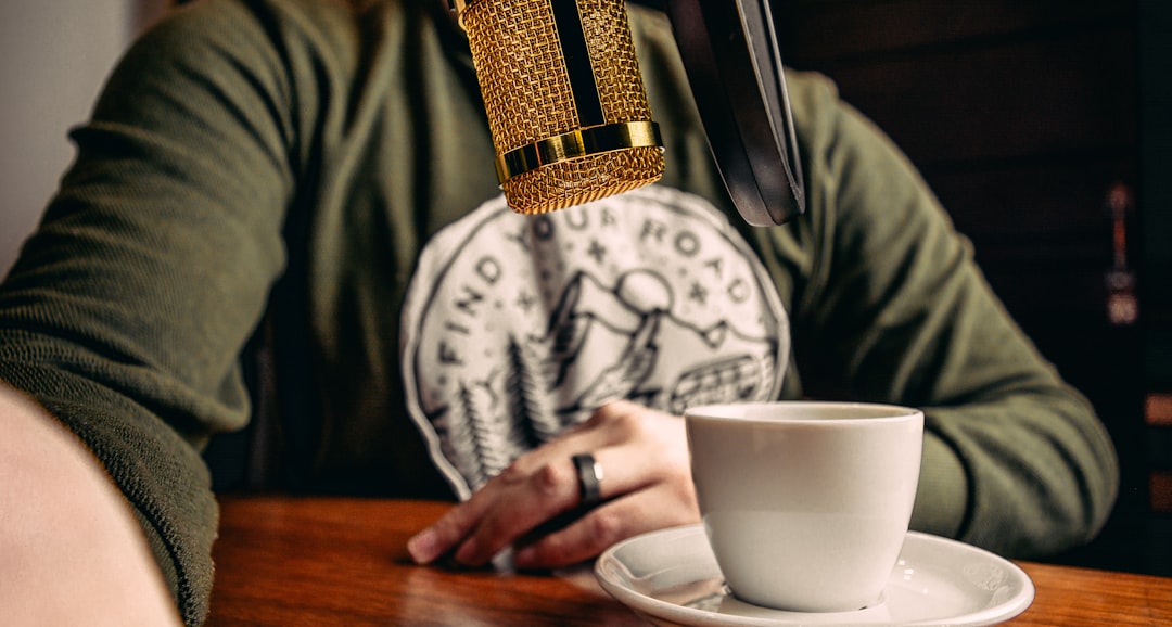 person holding white ceramic mug