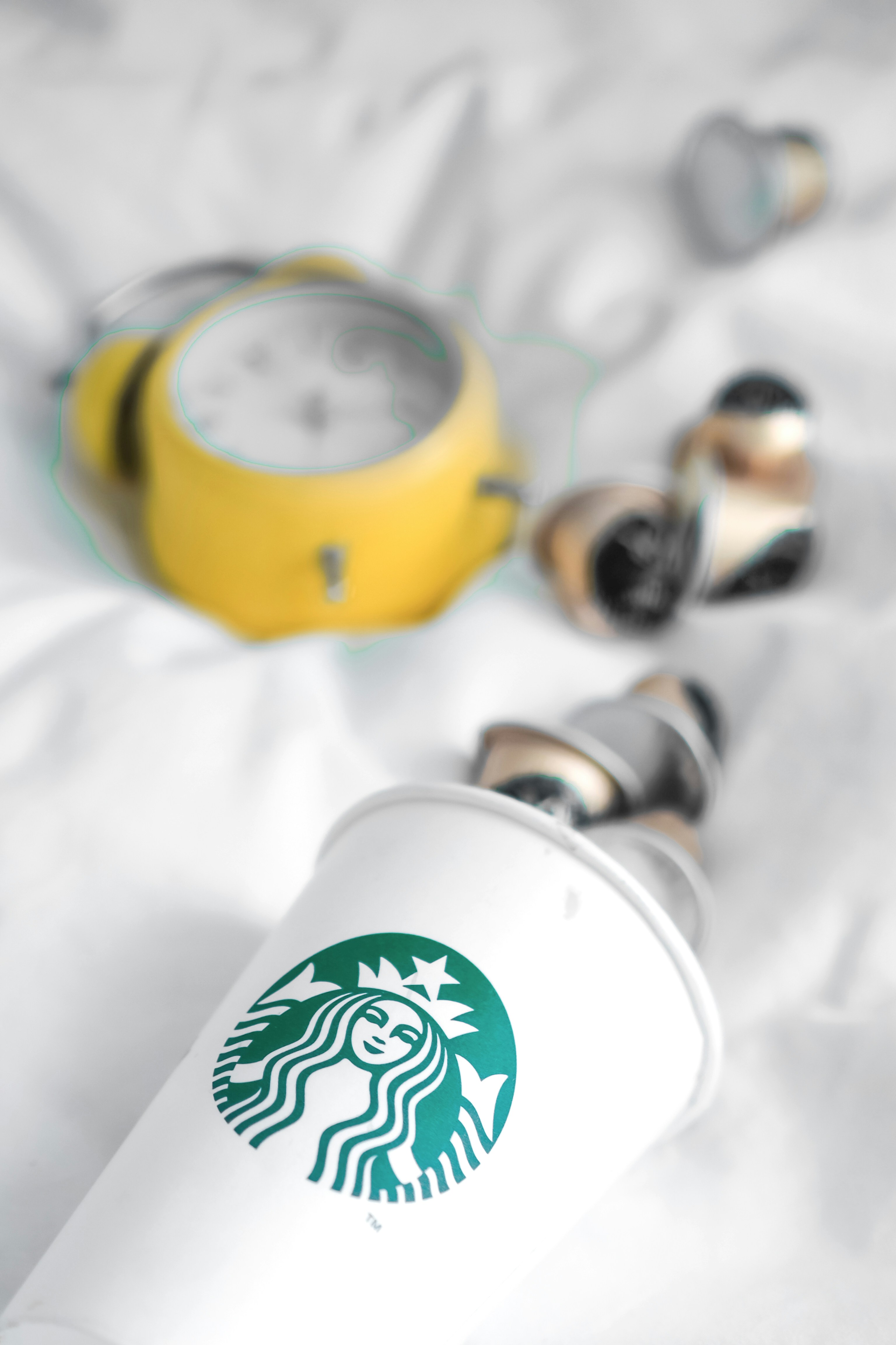 yellow and white starbucks mug