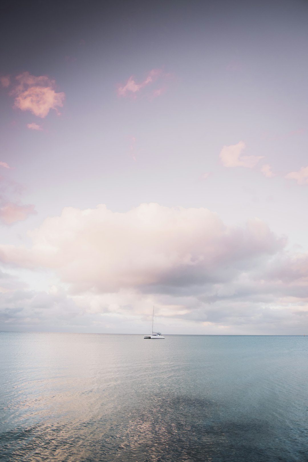 body of water under cloudy sky during daytime