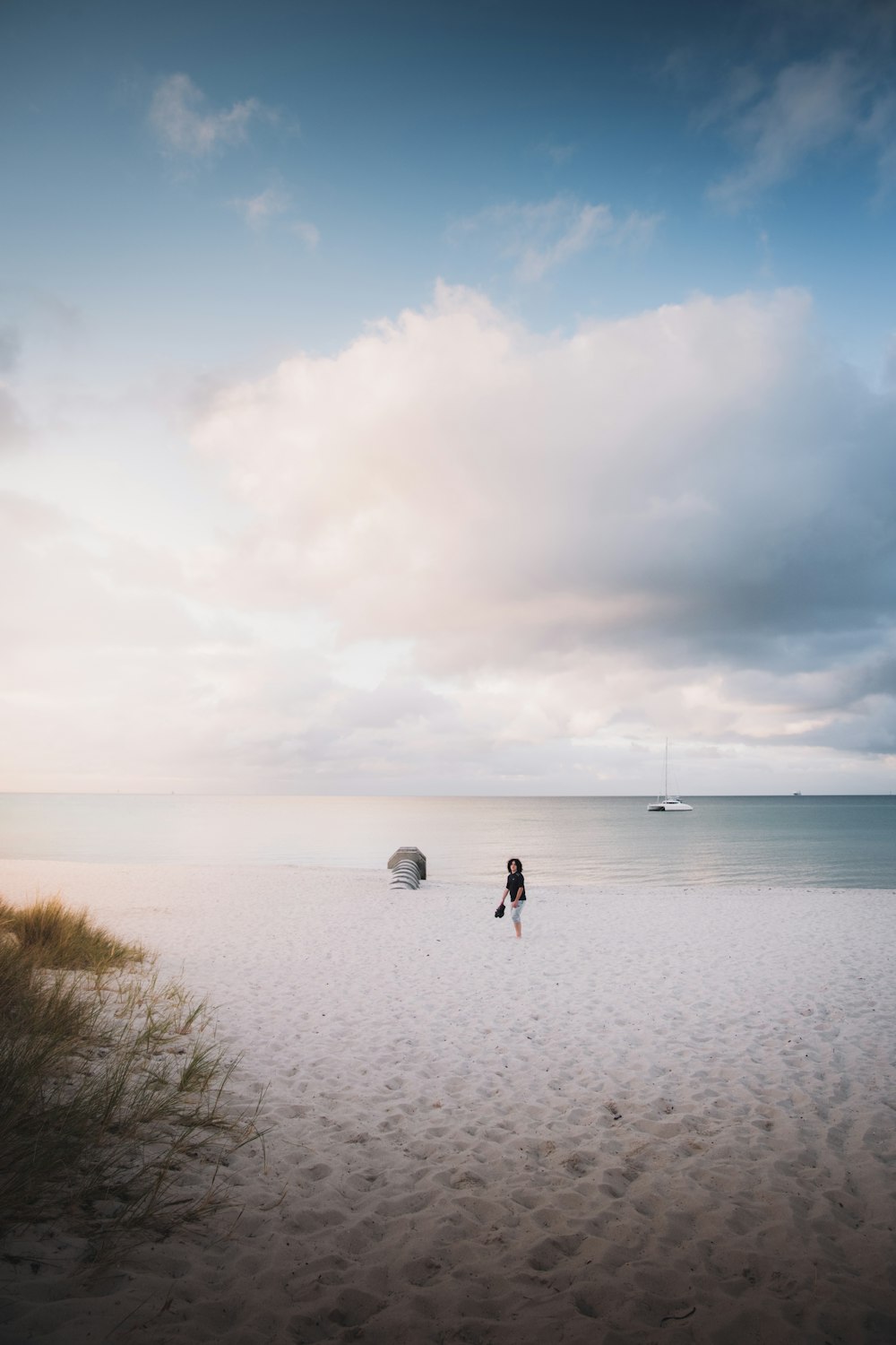 2 person playing soccer on beach during daytime