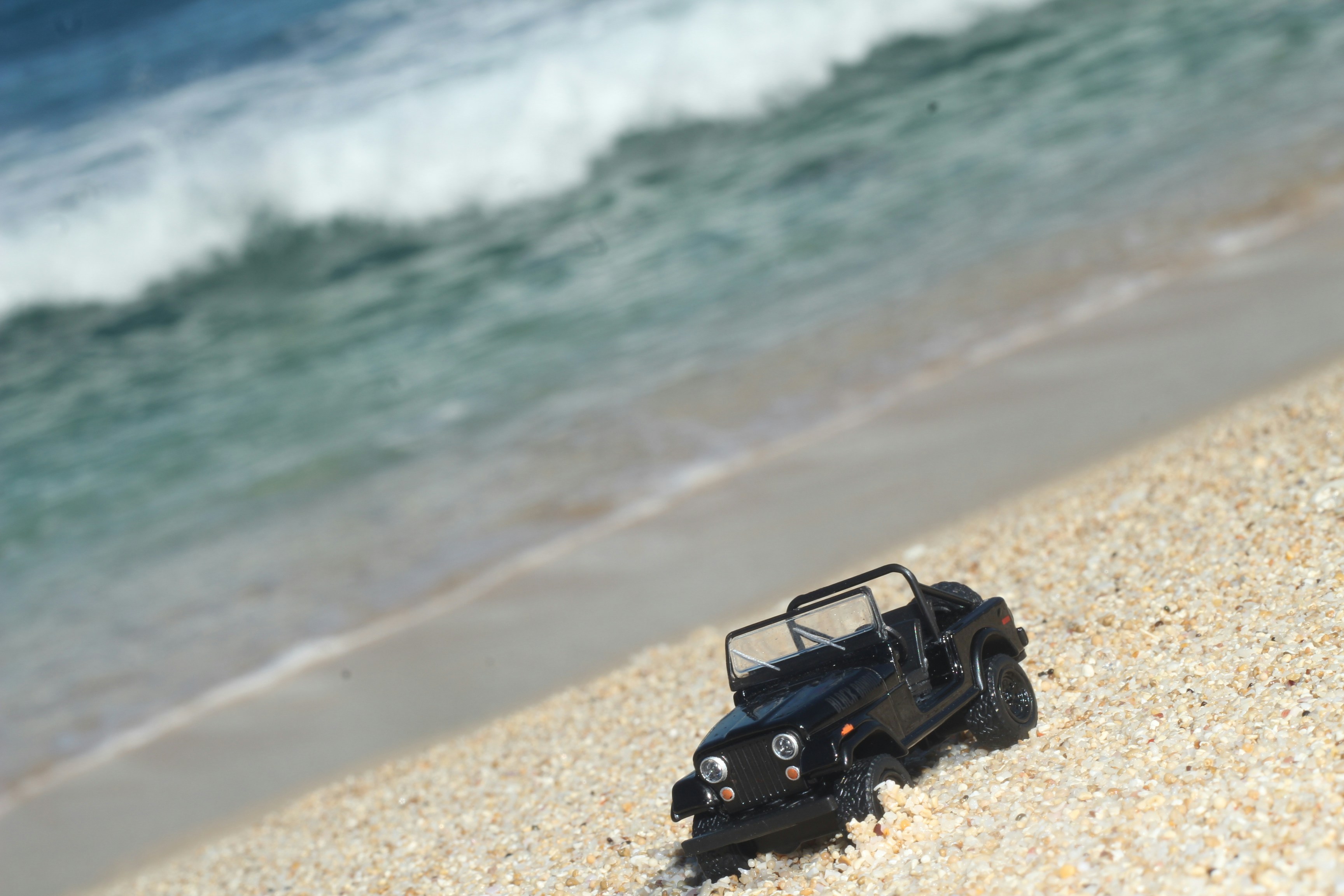 black jeep wrangler on beach during daytime