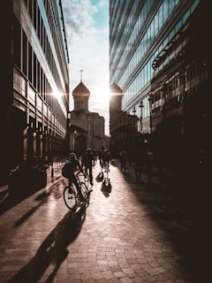 Evening view of the ezraider group riding along a quiet street in Larnaca, with warm sunset colors.
