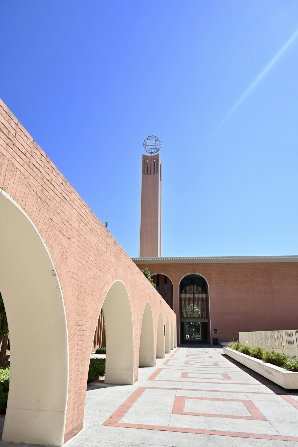 brown brick building under blue sky during daytime