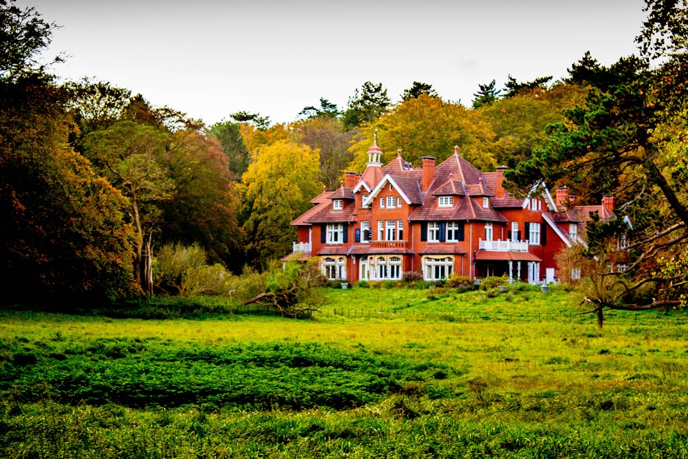 red and white house on green grass field