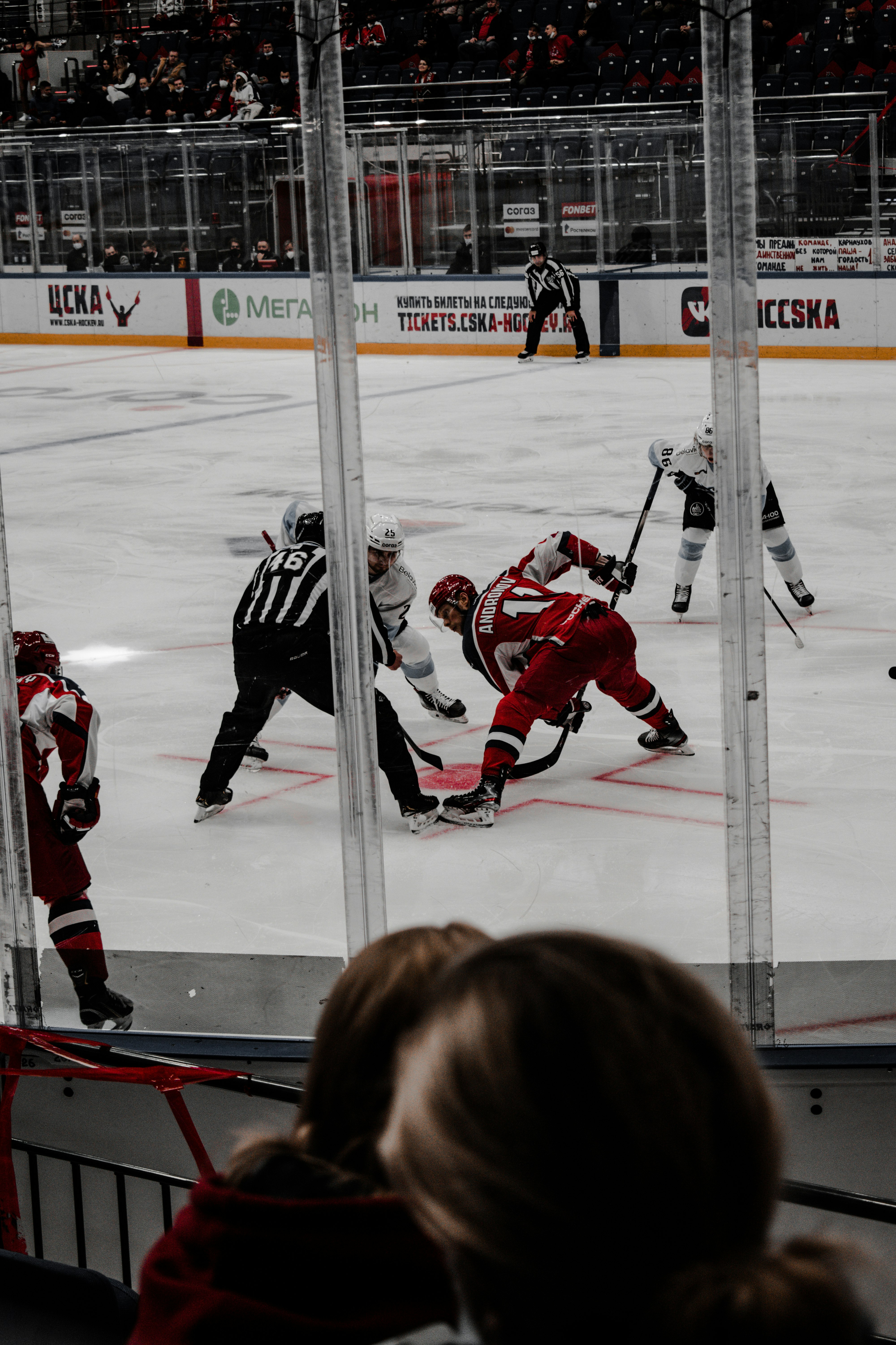 2 men in ice hockey jersey playing ice hockey