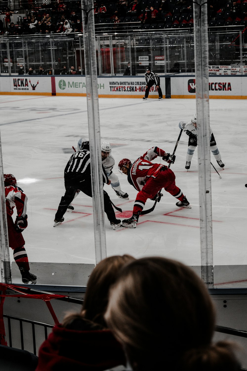 2 men in ice hockey jersey playing ice hockey